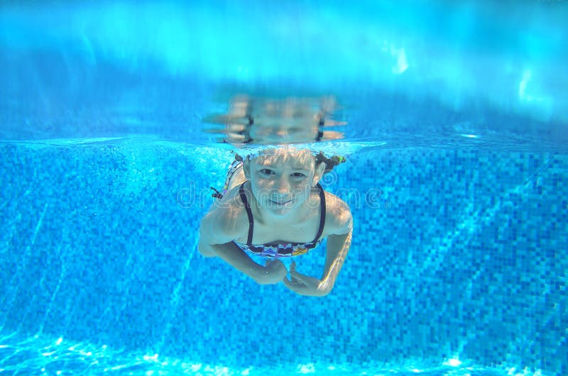 Child Swims in Pool Underwater, Happy Active Girl Has Fun Stock Photo ...