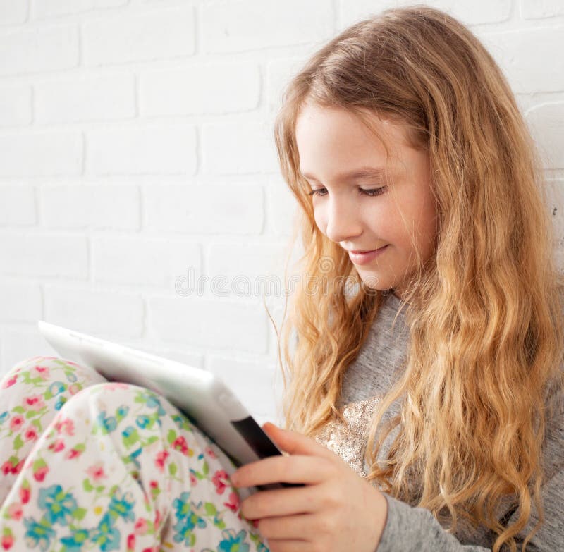 Child with tablet computer stock image. Image of meadow 31880921