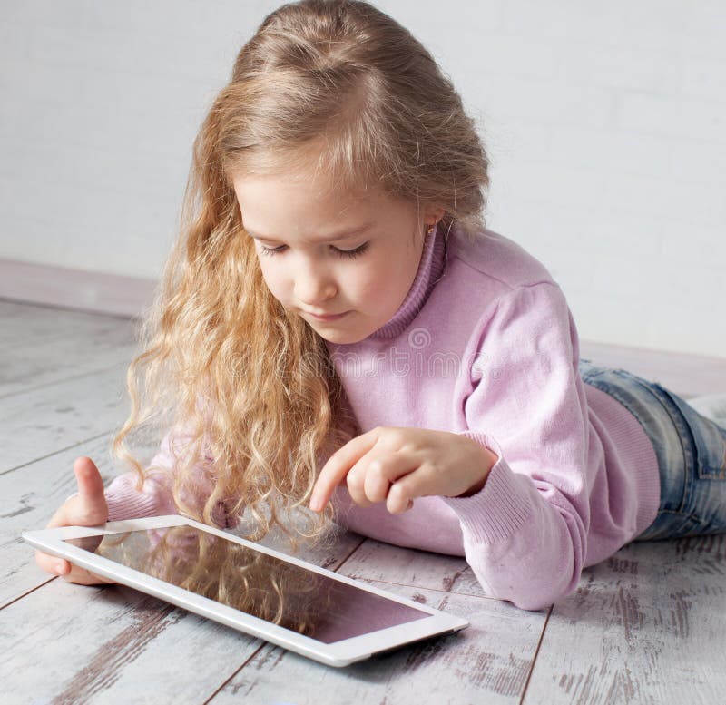 Child with tablet pc stock photos