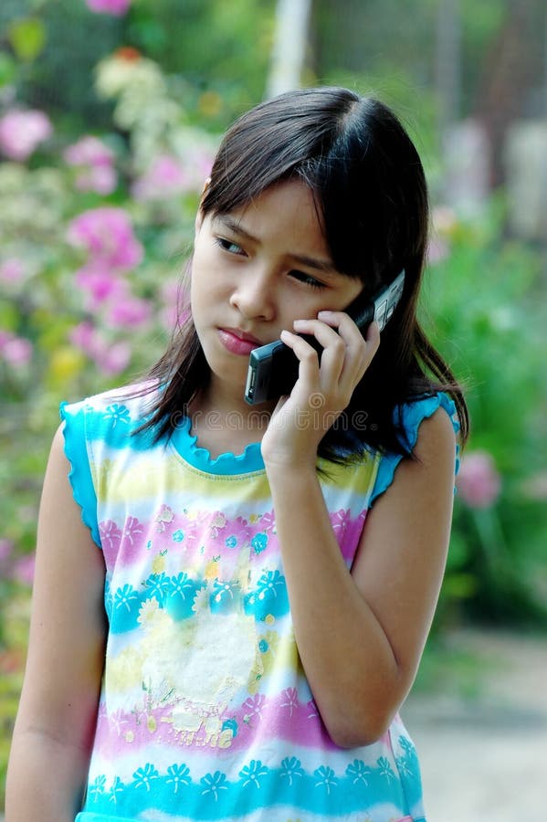 Child talking to the phone - outdoor/garden