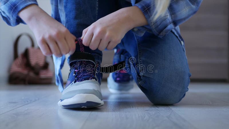 Child tying shoes laces, kid preparing leave house, girl going school, shoelaces