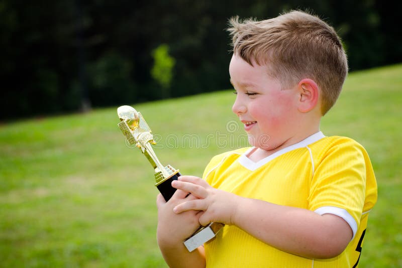 Child in Uniform with His New Trophy Stock Image - Image of small ...