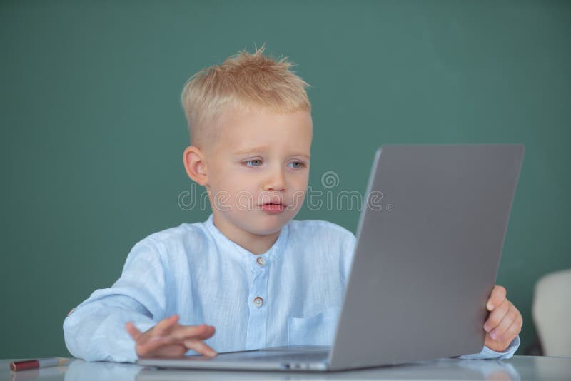 Child using gadgets to study. Computer education for kids. Little funny programmer. Genius child programming, computer training