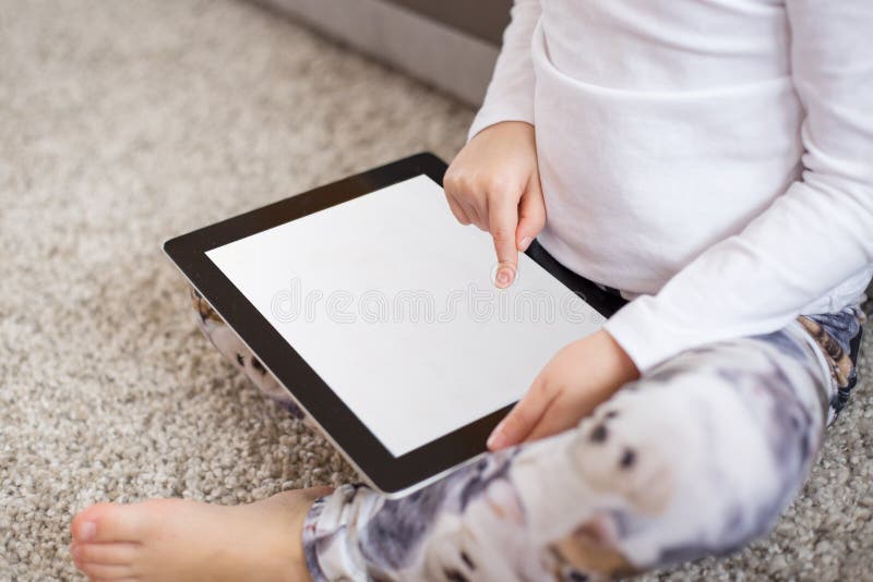 Child using tablet computer stock photo
