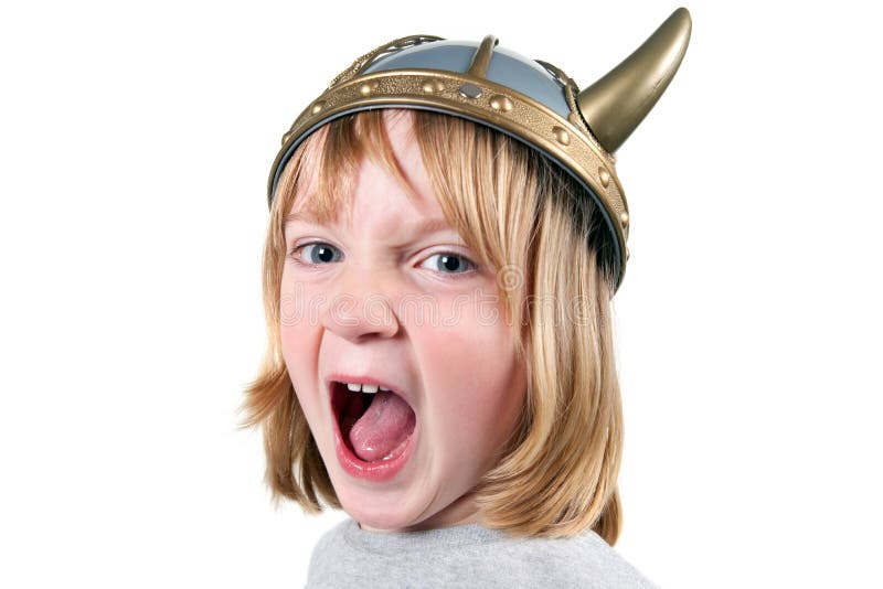 Angry child with viking helmet. boy isolated on white with expression of aggression. blond kid dressed up. Angry child with viking helmet. boy isolated on white with expression of aggression. blond kid dressed up