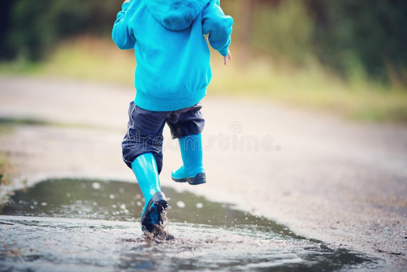 Child Walking in Wellies in Puddle on Rainy Weather Stock Photo - Image ...