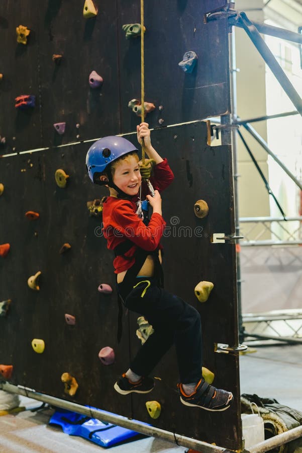 Child on the Walls of a Climbing Wall with the Help of a Safety Rope Stock Image Image of girl