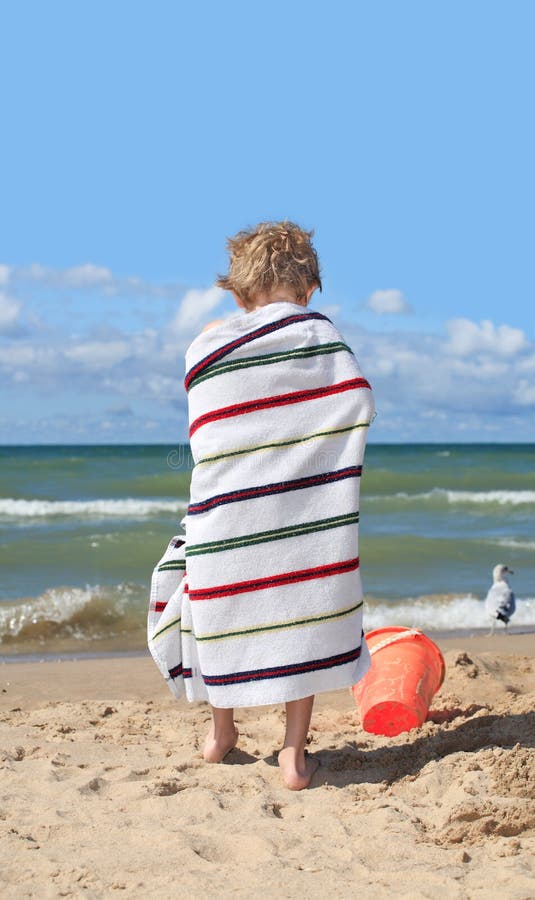 Child Wrapped in a Towel at the Beach Stock Photo Image of sand