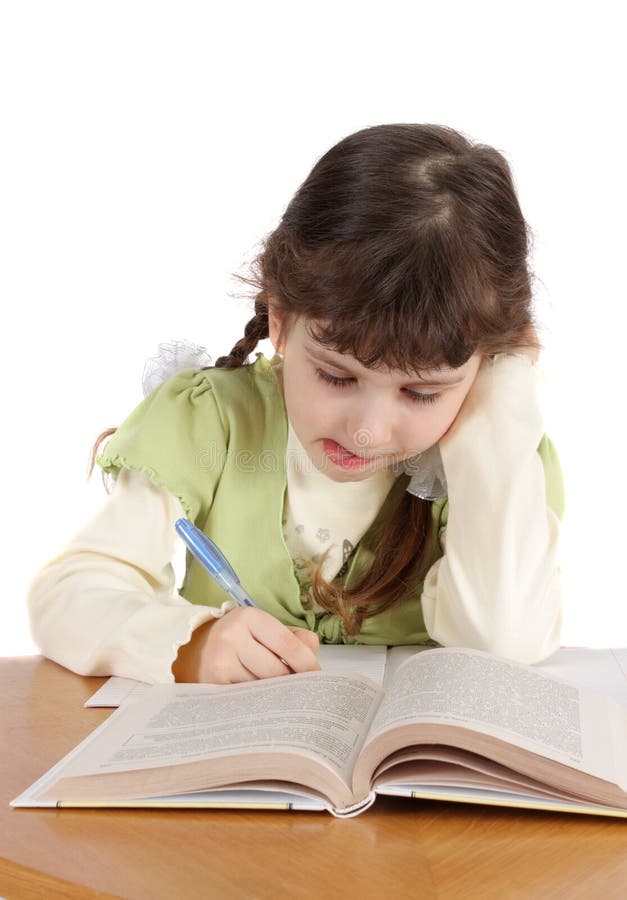 Child writes and reads,isolated. royalty free stock images Child writes and reads,isolated. royalty free stock images