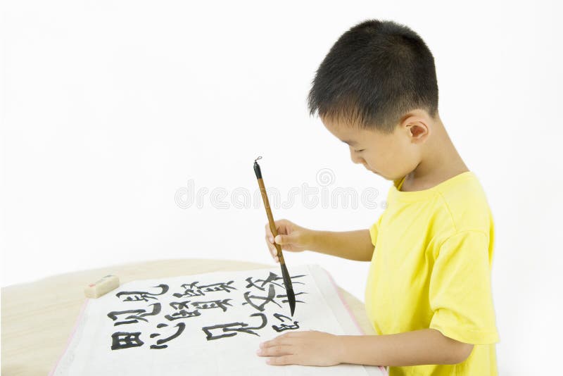 A child writing Chinese Calligraphy stock photo
