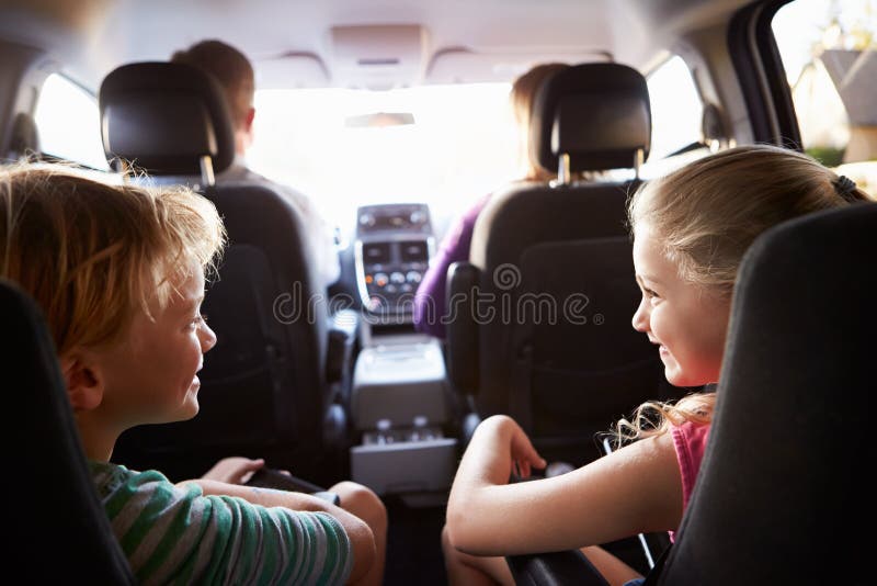 Children In Back Seat Of Car On Journey With Parents stock image Children In Back Seat Of Car On Journey With Parents stock image