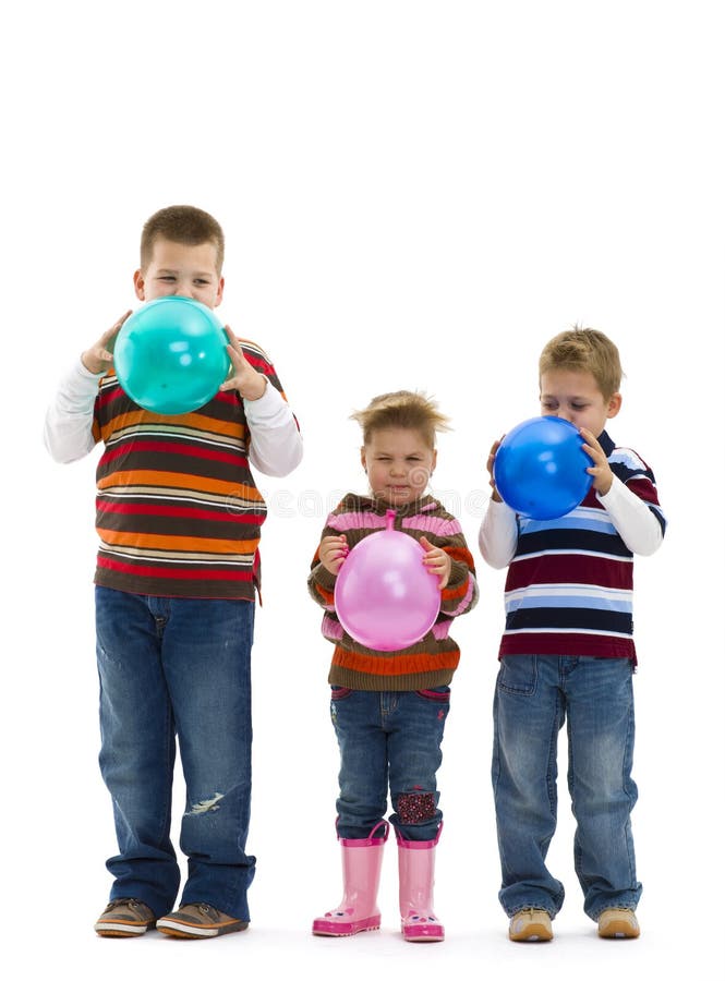 Children blowing up toy balloons