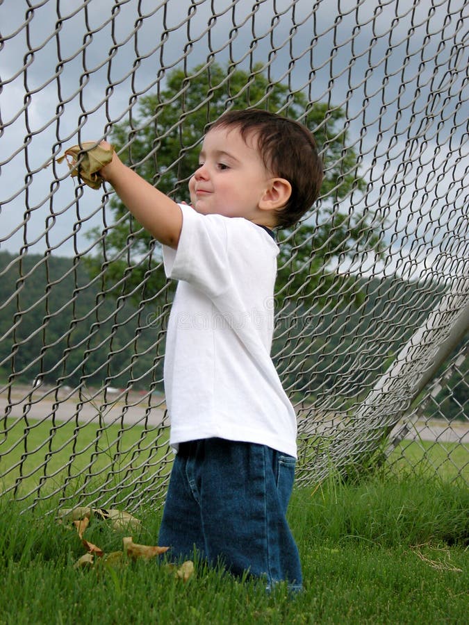 Children: Boy Playing with Leaves