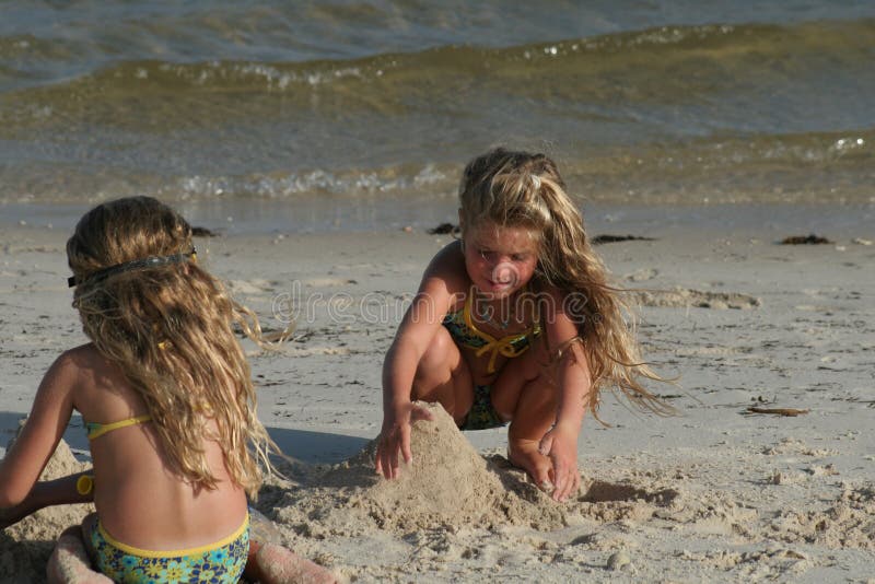 Children building sandcastle