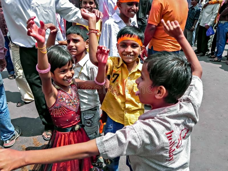Pune,Maharashtra,India-September 22nd,2010: Children dancing in front of ganesh idol during festival procession