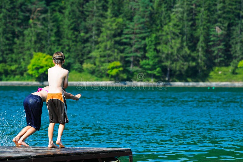 Children diving into the lake