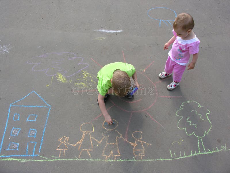 Children drawing on asphalt royalty free stock photos
