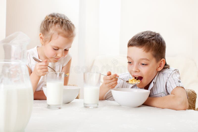 Children eat breakfast royalty free stock photo Children eat breakfast royalty free stock photo