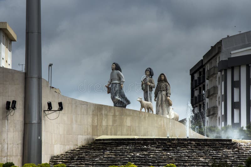 Children from Fatima, a small architectural monument on one of the roundabouts in Fatima