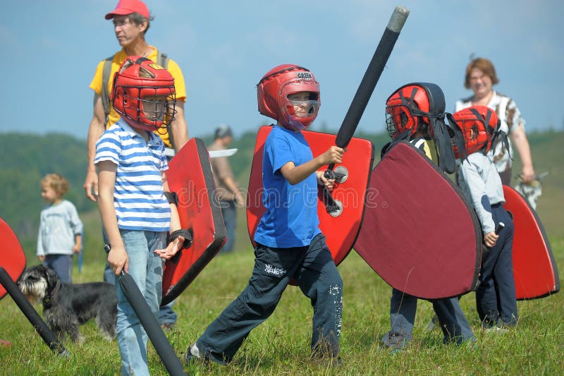 Children fighting with shield