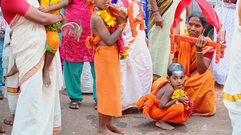 Children in Flower Garlands Dance among Fest Participants
