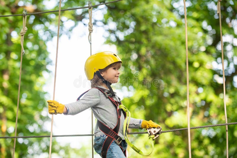 Children fun. Helmet and safety equipment. Safe Climbing extreme sport with helmet. Small boy enjoy childhood years stock image Children fun. Helmet and safety equipment. Safe Climbing extreme sport with helmet. Small boy enjoy childhood years stock image