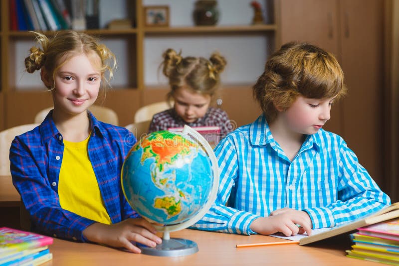 Children on the Geography Lesson in School Classroom. Educational