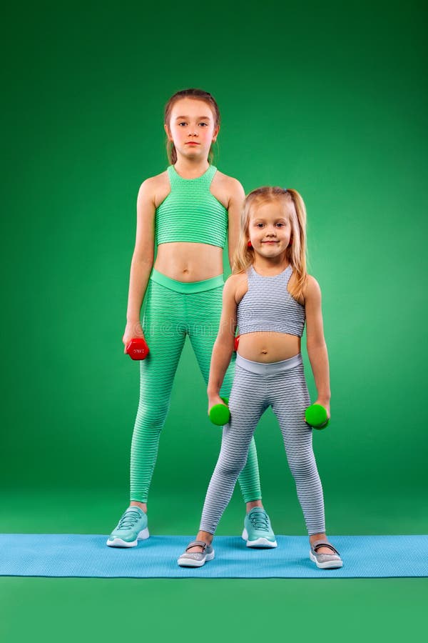 Children Girls Doing Fitness Exercises on Green Background Together ...