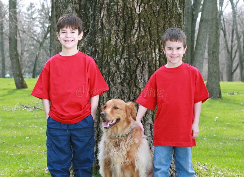 Boys and Golden Retriever stock image. Image of boys, animals 2524535
