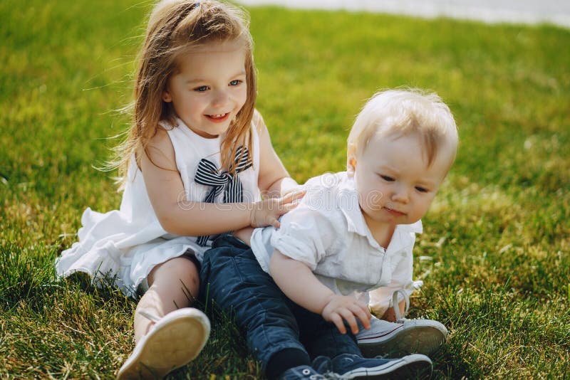 Children on a grass stock photo. Image of friend, children - 155978074