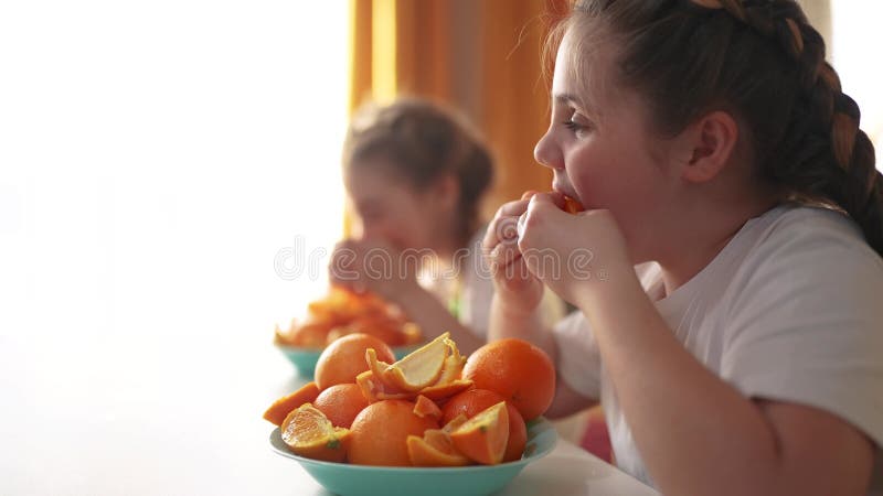 Children Group Oranges Fruit Food Lifestyle in the Kitchen. Healthy