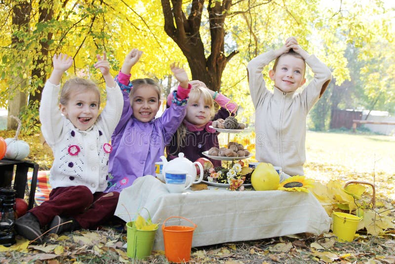 Children having fun on picnic at fall