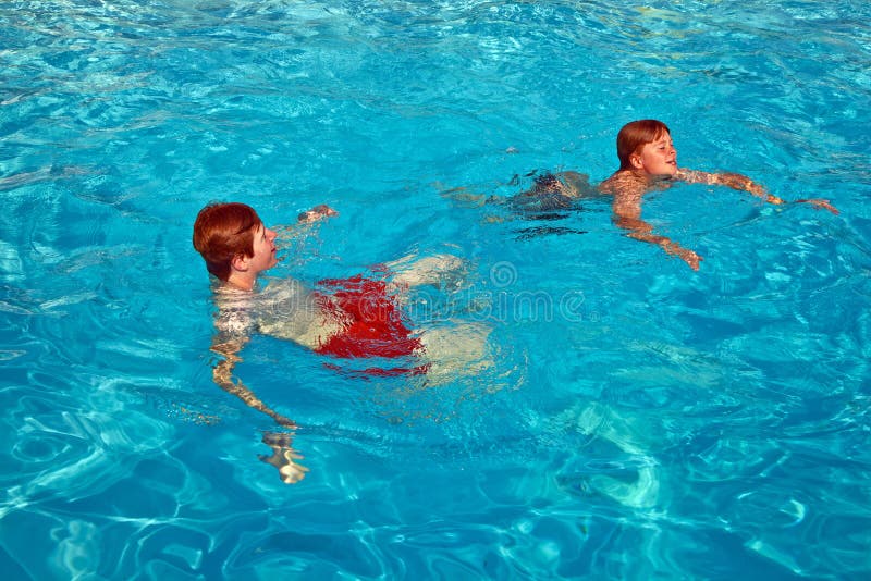 Children having fun in the pool