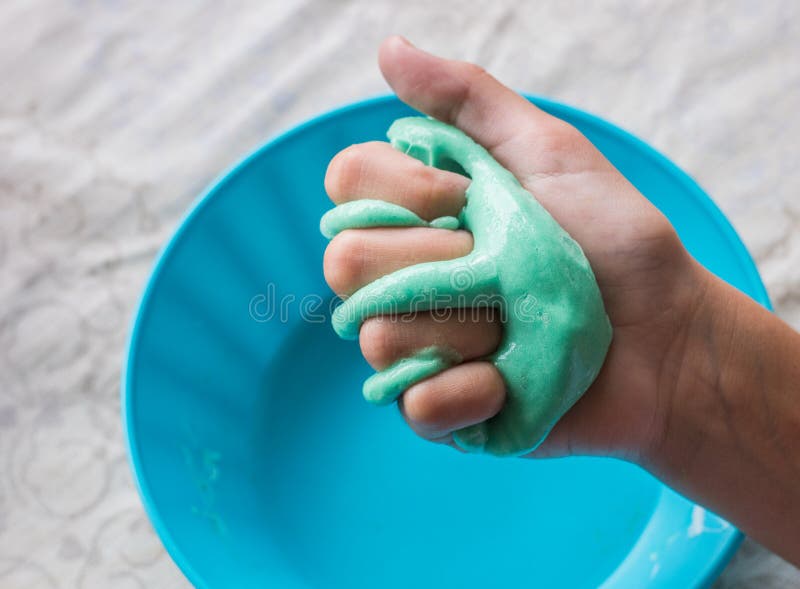 White Slime in Child Hands on Pink Background. Stock Photo - Image of  rubber, hobby: 163900518