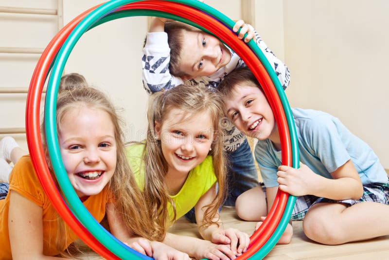 Children with hula hoops stock photography