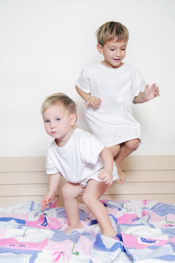 Children jumping on parent s bed