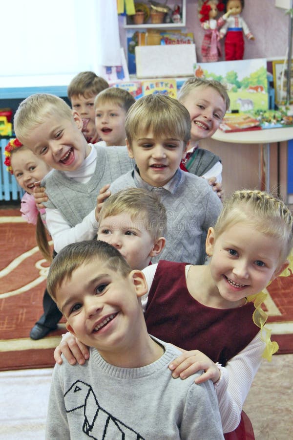 Children are laughing in kindergarten. Funny kids. Baby smiles stock image Children are laughing in kindergarten. Funny kids. Baby smiles stock image