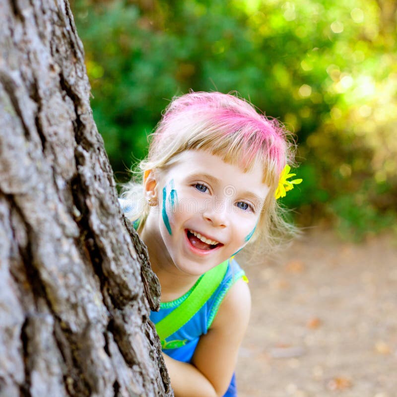 Children little girl happy playing in forest tree