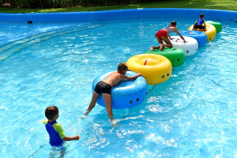 Thailand. Hua hin. February 2020. Children in water Park. Fun in the tropics. Happy kids in the pool. Thailand. Hua hin. February 2020. Children in water Park. Fun in the tropics. Happy kids in the pool.