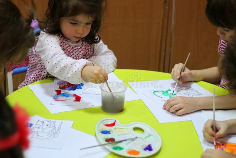 Children painting at kindergarten