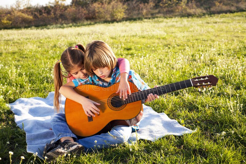 Children play guitar