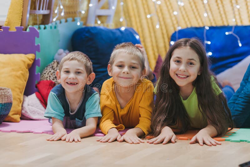 Children play at home with pillows and covered blanket stock images