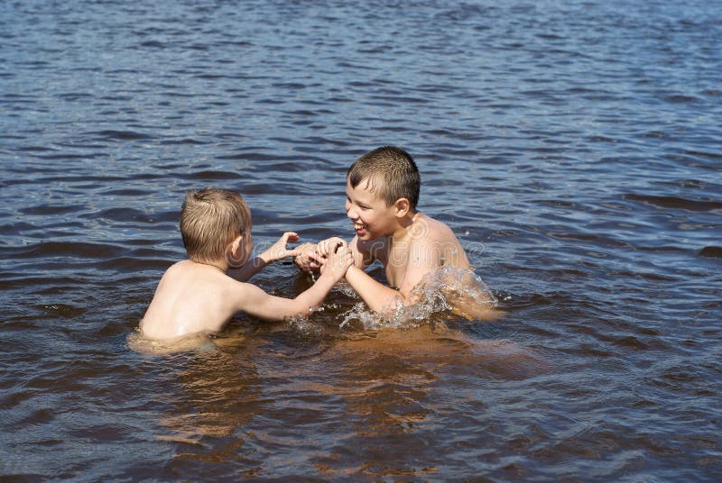 Children play in the river