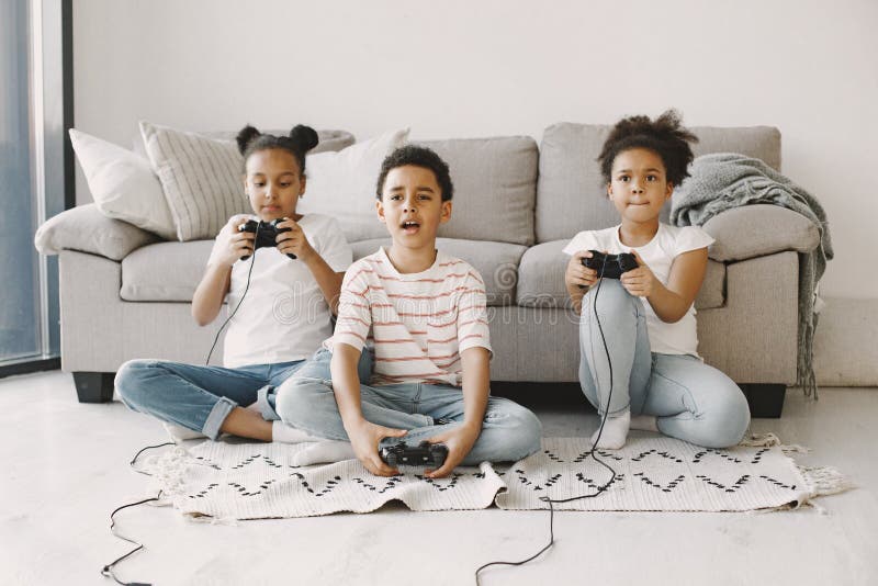 Smiling African Boy Playing Online Games in Class Stock Photo - Image of  phone, modern: 177228872