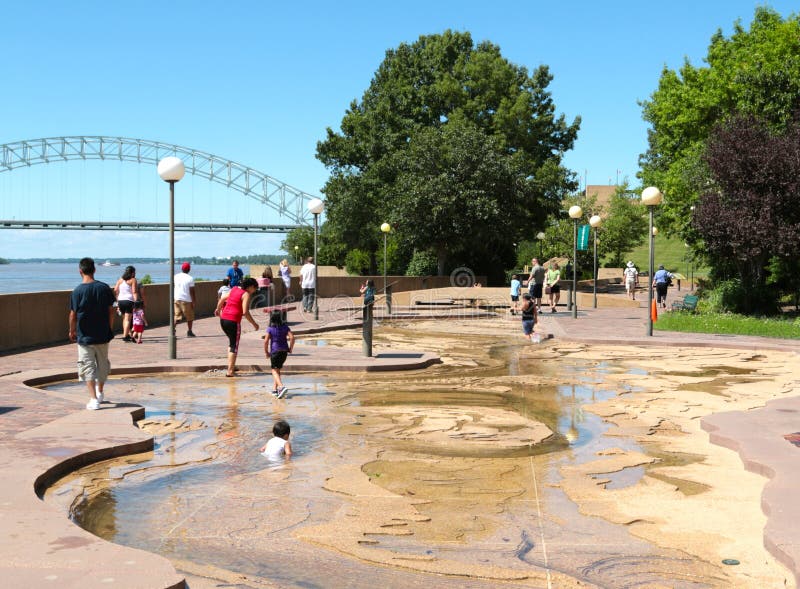 Children Play in the Water at the River Park on Mud Island