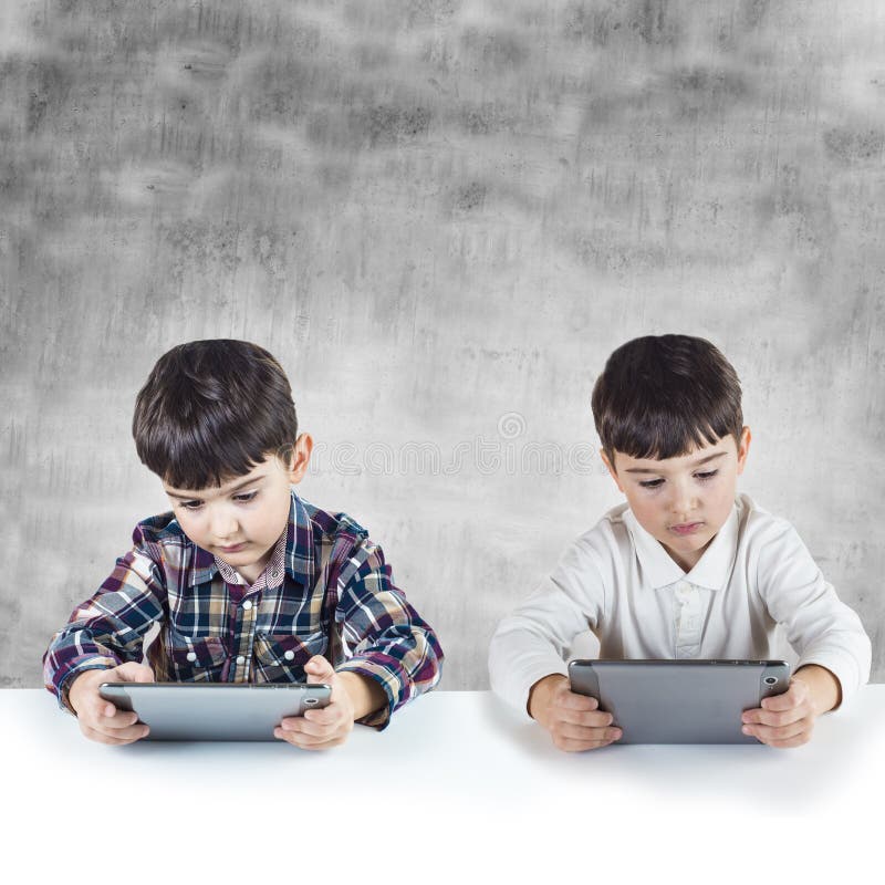 Children playing with a digital tablet