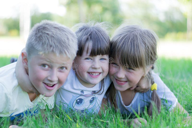 Children Playing on the Grass Stock Photo - Image of friendship ...