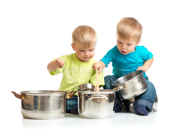 Children Playing with Pans As they are Cooking Together Stock Image