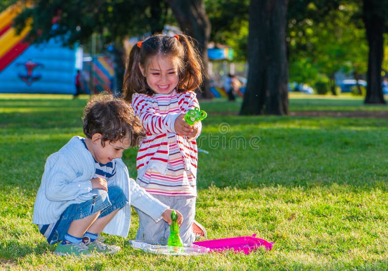 Children Playing in the Park Stock Photo - Image of pursuit, grass ...