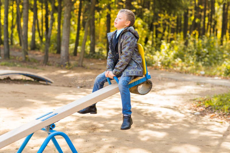 Children Playing on a School Playground during Recess. Stock Image